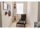 Charming sitting area with chair and ottoman, perfect for relaxation and reading at 1156 Mckee Farm Ln, Belmont, NC 28012