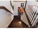 Elegant staircase leading down to the dining room with hardwood stairs and white railing at 1156 Mckee Farm Ln, Belmont, NC 28012