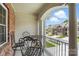 Charming balcony with wrought iron furniture and a view of the neighborhood at 11724 Easthampton Cir, Charlotte, NC 28277