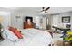 Bedroom with a neutral color palette, ceiling fan, and adjoining bathroom at 11724 Easthampton Cir, Charlotte, NC 28277