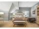Bedroom featuring sloped ceilings, a cozy seating area, and ample natural light at 11724 Easthampton Cir, Charlotte, NC 28277