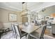 Open-concept dining room showing an adjacent living room with a fireplace at 11724 Easthampton Cir, Charlotte, NC 28277