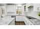 White kitchen with granite countertops and stainless steel appliances at 11724 Easthampton Cir, Charlotte, NC 28277