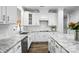 Bright white kitchen featuring granite countertops and stainless steel appliances at 11724 Easthampton Cir, Charlotte, NC 28277