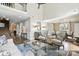Spacious living room with hardwood floors and staircase to second floor, adjoining dining room at 11724 Easthampton Cir, Charlotte, NC 28277