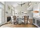 Bright living room with fireplace, hardwood floors, ceiling fan, and staircase to the second floor at 11724 Easthampton Cir, Charlotte, NC 28277