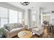 Cozy living room featuring hardwood floors, a large window, and comfortable seating arrangement at 11724 Easthampton Cir, Charlotte, NC 28277