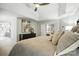 Bright primary bedroom with tray ceilings, sitting area, and adjoining bathroom at 11724 Easthampton Cir, Charlotte, NC 28277
