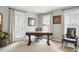 Bright office space with natural light from windows and door leading to outdoor space at 11724 Easthampton Cir, Charlotte, NC 28277