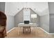 Charming home office featuring a stylish chandelier and a bright workspace with modern furnishings at 11724 Easthampton Cir, Charlotte, NC 28277