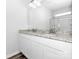 Modern bathroom with dual sinks, granite countertops, white cabinetry, and a large mirror at 1225 Langston Ln, Salisbury, NC 28144