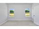 Neutral bedroom with two large windows providing natural light and plush carpet flooring at 1225 Langston Ln, Salisbury, NC 28144