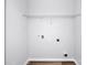 Walk-in closet features a white wire rack shelf and hookups for a washer and dryer, providing space for storage at 1225 Langston Ln, Salisbury, NC 28144