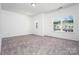 Spacious bedroom featuring neutral carpet, ample natural light, and neutral walls at 1237 Langston Ln, Salisbury, NC 28144