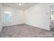 Cozy bedroom featuring neutral carpet, neutral walls and ample light at 1237 Langston Ln, Salisbury, NC 28144