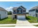Two story home featuring stone accents, two-car garage, well-manicured lawn and dark shutters at 1237 Langston Ln, Salisbury, NC 28144