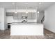 Modern kitchen featuring granite countertops, stainless steel appliances, and stylish gray cabinetry at 1237 Langston Ln, Salisbury, NC 28144
