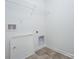 Laundry room featuring tiled floors, utility hookups, and white walls at 1237 Langston Ln, Salisbury, NC 28144