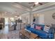 Open-concept living room features a dining area with a modern chandelier and flows seamlessly into a stylish kitchen at 1242 Langston Ln, Salisbury, NC 28144