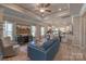Bright open-concept living area with sleek wood floors, and a dining area that leads to the well-equipped kitchen at 1242 Langston Ln, Salisbury, NC 28144