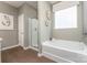 Stylish bathroom showcasing a soaking tub, glass-enclosed shower, and modern fixtures at 1248 Langston Ln, Salisbury, NC 28144