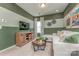 Cozy bonus room featuring a comfortable sofa, entertainment center, and stylish decor at 1248 Langston Ln, Salisbury, NC 28144