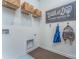 Functional laundry room with storage shelves, a utility sink, and space for laundry appliances at 1248 Langston Ln, Salisbury, NC 28144