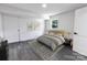 Cozy bedroom with gray walls, neutral bedding, and a window for natural light at 132 Kennedy Ave, Kannapolis, NC 28083