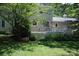 View of the deck and backyard of the home with mature trees and greenery at 1325 Lee Lynn Dr # 7 Part Of 6, Albemarle, NC 28001