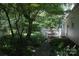 Outdoor deck with dining table and chairs overlooking lush greenery in backyard at 1325 Lee Lynn Dr # 7 Part Of 6, Albemarle, NC 28001