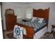 Charming bedroom showcasing a traditional quilt and wooden furniture at 1325 Lee Lynn Dr # 7 Part Of 6, Albemarle, NC 28001