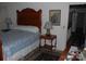 Comfortable bedroom showcasing an antique wooden bed frame at 1325 Lee Lynn Dr # 7 Part Of 6, Albemarle, NC 28001