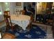 Elegant dining room features a hardwood floor, round table and floral decorated china closet at 1325 Lee Lynn Dr # 7 Part Of 6, Albemarle, NC 28001