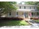 Inviting two-story home featuring a spacious porch, tidy landscaping, and an American flag at 1325 Lee Lynn Dr # 7 Part Of 6, Albemarle, NC 28001