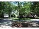 View of home featuring a separate two-car garage on a beautifully landscaped lot at 1325 Lee Lynn Dr # 7 Part Of 6, Albemarle, NC 28001