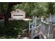 Detached garage with a white door, surrounded by lush greenery at 1325 Lee Lynn Dr # 7 Part Of 6, Albemarle, NC 28001