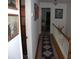 Well-lit hallway featuring a decorative runner and wood staircase at 1325 Lee Lynn Dr # 7 Part Of 6, Albemarle, NC 28001