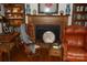 A cozy living room with fireplace, hardwood floors, and a built-in bookcase adds charm at 1325 Lee Lynn Dr # 7 Part Of 6, Albemarle, NC 28001