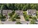 Aerial view showing a home with a well-manicured lawn and mature trees in a quiet neighborhood at 137 Branchview Dr, Mooresville, NC 28115