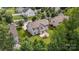 Aerial view showcasing a home with a well-maintained lawn, patio, and surrounding lush greenery at 137 Branchview Dr, Mooresville, NC 28115