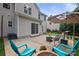 Inviting back patio with outdoor seating, grill, and a charming outdoor space perfect for entertaining at 137 Branchview Dr, Mooresville, NC 28115