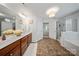 Lovely bathroom featuring double vanity, walk-in shower and tile floor at 137 Branchview Dr, Mooresville, NC 28115