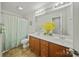 Double vanity bathroom with framed mirror, shower-tub combo, and tile floors at 137 Branchview Dr, Mooresville, NC 28115