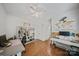Bright bedroom featuring hardwood floors, white walls, and a ceiling fan at 137 Branchview Dr, Mooresville, NC 28115