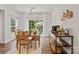 Inviting dining room with natural light, wood floors, and coffee bar at 137 Branchview Dr, Mooresville, NC 28115