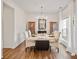 Elegant dining room with a marble table, modern chandelier, and hardwood flooring at 137 Branchview Dr, Mooresville, NC 28115
