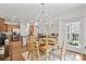 Lovely dining area with wood floors, modern lighting, and stainless steel appliances at 137 Branchview Dr, Mooresville, NC 28115