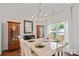 Formal dining room with marble table, stylish chandelier, and elegant decor at 137 Branchview Dr, Mooresville, NC 28115