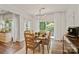 Bright dining area with natural light, wood floors, and seating for six guests at 137 Branchview Dr, Mooresville, NC 28115