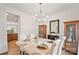 Elegant dining room with stylish marble table, chairs, and natural lighting at 137 Branchview Dr, Mooresville, NC 28115